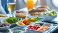 Healthy airplane meal with fresh ingredients served on a tray table, emphasizing nutritious in-flight dining options Royalty Free Stock Photo