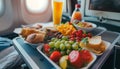 Healthy airplane meal with fresh ingredients served on a tray table, emphasizing nutritious in-flight dining options Royalty Free Stock Photo