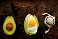 Healthy, alkaline breakfast with avocado sandwich and quail eggs on a grunge background