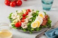 Healthy American Cobb salad with egg bacon avocado chicken tomato. hearty keto low carb diet