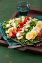 Healthy American Cobb salad with egg bacon avocado chicken tomato. hearty keto low carb diet Royalty Free Stock Photo