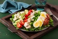 healthy American Cobb salad with egg bacon avocado chicken tomato. hearty keto low carb diet Royalty Free Stock Photo