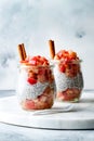 Healthy apple pie chia pudding with cinnamon in a glass jar. Seasonal autumn breakfast. Vegan healthy breakfast