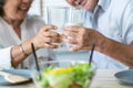 Healthy asian Elderly couple enjoying drinking fresh milk from glass Royalty Free Stock Photo