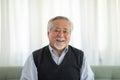 Healthy Asian Elderly man with white hairs smile so happiness and cheerful at home,Portrait of senior man enjoying retirement at