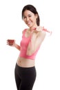 Healthy Asian girl diet with tomato juice and measuring tape on Royalty Free Stock Photo