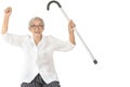 Healthy asian senior woman raise hand up with fist and raise walking stick,show a strong body,arm muscle power,physical strength, Royalty Free Stock Photo