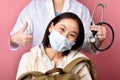 Healthy asian woman backpacker smiling with doctor showing thumb up in hospital, Traveler and tourist worry free insurance. Royalty Free Stock Photo