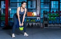 Healthy asian women are doing lifting gear, she`s doing weight training exercises with Kettlebell at the fitness or gym with blur