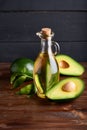 Healthy Avocado oil in glass bottles. Dark background Copy space