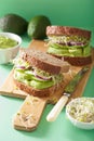 Healthy avocado sandwich with cucumber alfalfa sprouts onion Royalty Free Stock Photo