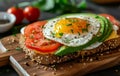 Healthy Avocado Toast with Egg and Tomatoes Royalty Free Stock Photo