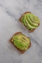 Healthy avocado toast. Mashed avocado on whole grain rye bread