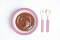 Healthy baby food, fork and spoon on background, flat lay