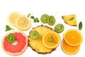 healthy background. slices of grapefruit, kiwi fruit, orange and pineapple isolated on white background top view Royalty Free Stock Photo