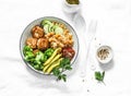 Healthy balanced buddha bowl lunch - spicy couscous with chickpeas, broccoli, green beans and turkey meatballs on light background