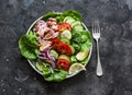 Healthy balanced diet food - canned tuna, tomatoes, cucumbers, romaine salad, red onion, olive oil salad dressing appetizer, lunch Royalty Free Stock Photo