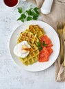 Zucchini waffles with salmon and benedict egg, fodmap diet top view