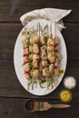 Healthy barbecue. Chicken kebab with vegetables and herbs, juicy tasty snack for a summer picnic, top view