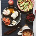 Healthy and beautiful breakfast: bread with salmon, cottage cheese, avocado and cucumber