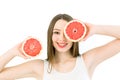 Healthy, beautiful smile, cute happy girl holding halves of grapefruit near face. Healthy food concept. Skin care and Royalty Free Stock Photo