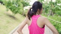 Healthy beautiful young Asian Athlete women in sports clothing legs warming and stretching her arms to ready for running on street Royalty Free Stock Photo