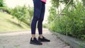 Healthy beautiful young Asian Athlete women in sports clothing legs warming and stretching her arms to ready for running on street Royalty Free Stock Photo