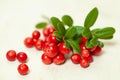 Healthy berries. Red cowberry on white wooden board