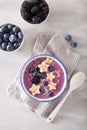 Healthy berry smoothie bowl with banana and sesame seed Royalty Free Stock Photo