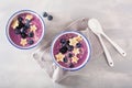 Healthy berry smoothie bowl with banana and sesame seed