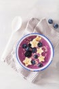 Healthy berry smoothie bowl with banana and sesame seed Royalty Free Stock Photo