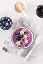 Healthy berry smoothie bowl with banana and sesame seed Royalty Free Stock Photo