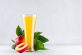 Healthy beverage - fresh juice of nectarines and ingredients on light white wooden board. Fresh summer season background. Royalty Free Stock Photo