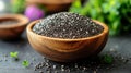 Healthy black seeds in wooden bowl Royalty Free Stock Photo