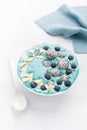 healthy blue spirulina smoothie bowl with blueberry, white chocolate, dragon fruit, chia seed