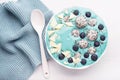 healthy blue spirulina smoothie bowl with blueberry, white chocolate, dragon fruit, chia seed