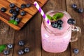Healthy Blueberry Smoothie In A Mason Jar Glass, Downward View Against Rustic Wood