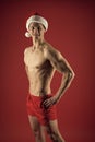 Healthy body. Excellent shape. Santa claus diet. Athlete man wear santa hat. Sexy athletic macho in santa claus hat. New Royalty Free Stock Photo