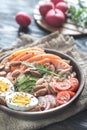 Healthy bowl with salmon, avocado, egg and vegs Royalty Free Stock Photo