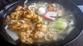 Healthy bowl of udon noodles in hot soup, with deep fried chicken karaage pieces Royalty Free Stock Photo