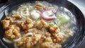 Healthy bowl of udon noodles in hot soup, with deep fried chicken karaage pieces Royalty Free Stock Photo