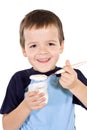 Healthy boy eating yogurt Royalty Free Stock Photo