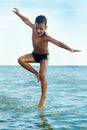 Healthy boy jumping in water Royalty Free Stock Photo