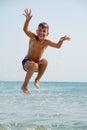 Healthy boy jumping in water Royalty Free Stock Photo