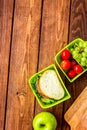 Healthy break with apple, grape and sandwich in lunchbox on home table flat lay mock-up Royalty Free Stock Photo