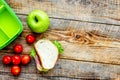 Healthy break with apple, grape and sandwich in lunchbox on home table flat lay mock-up Royalty Free Stock Photo