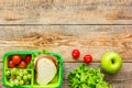 Healthy break with apple, grape and sandwich in lunchbox on home table flat lay mock-up Royalty Free Stock Photo