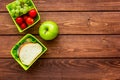 Healthy break with apple, grape and sandwich in lunchbox on home table flat lay mock-up Royalty Free Stock Photo