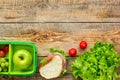 Healthy break with apple, grape and sandwich in lunchbox on home table flat lay mock-up Royalty Free Stock Photo