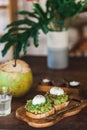 Healthy breakfast - avocado on toast with poached eggs, fresh young coconut Royalty Free Stock Photo